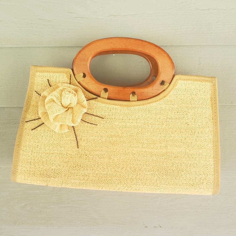 cream bag with wooden handle and flower